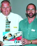 Willem Erasmus (right) receiving his prize from MD, Alan Wynn